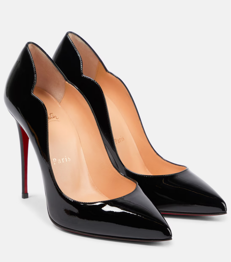 Black high-heeled shoes with red soles on a white background