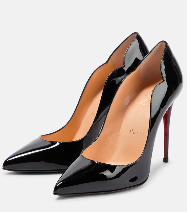 Black high-heeled shoes with a red sole on a white background