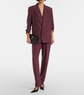 Person wearing a burgundy suit with a white background