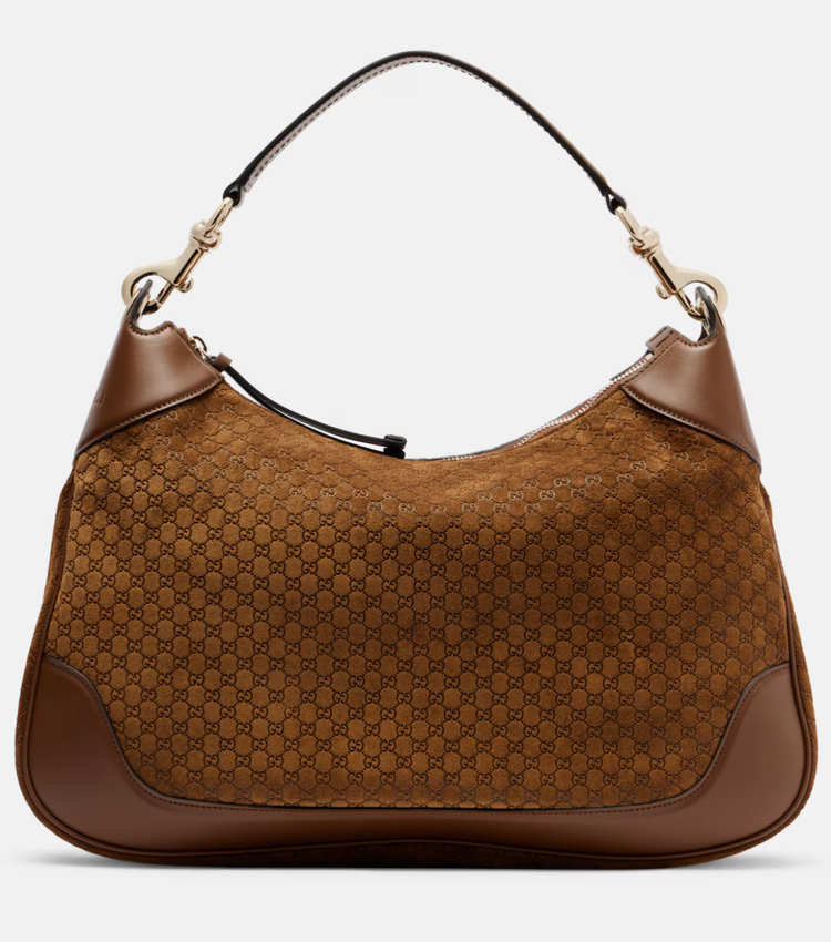 Brown handbag with a patterned design on a white background