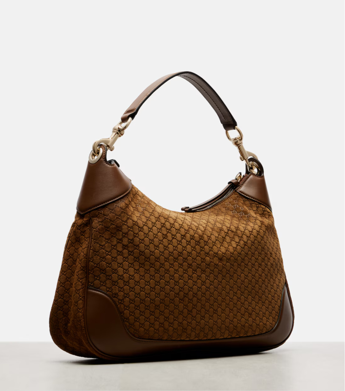 Brown handbag with a pattern on a white background