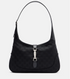 Black handbag with a silver clasp on a light gray background
