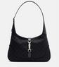 Black handbag with a silver clasp on a light gray background