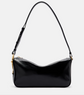 Black handbag with a strap on a light gray background