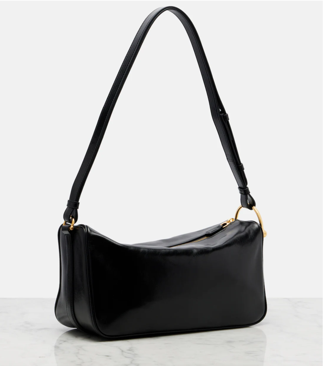 Black handbag with a shoulder strap on a white background